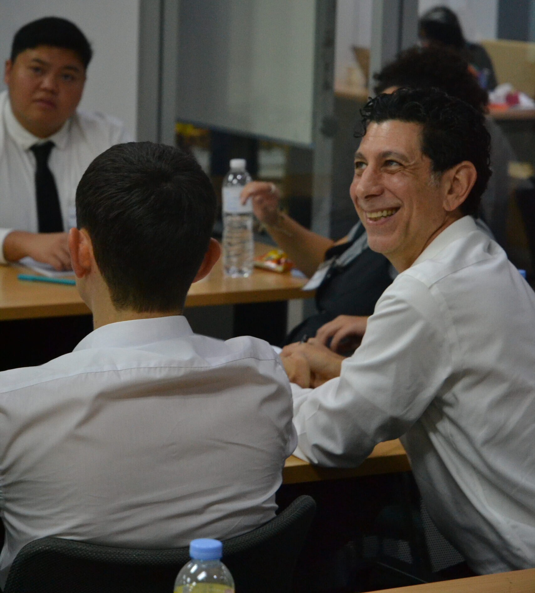 a new teacher smiles during teacher training in Bangkok Thailand